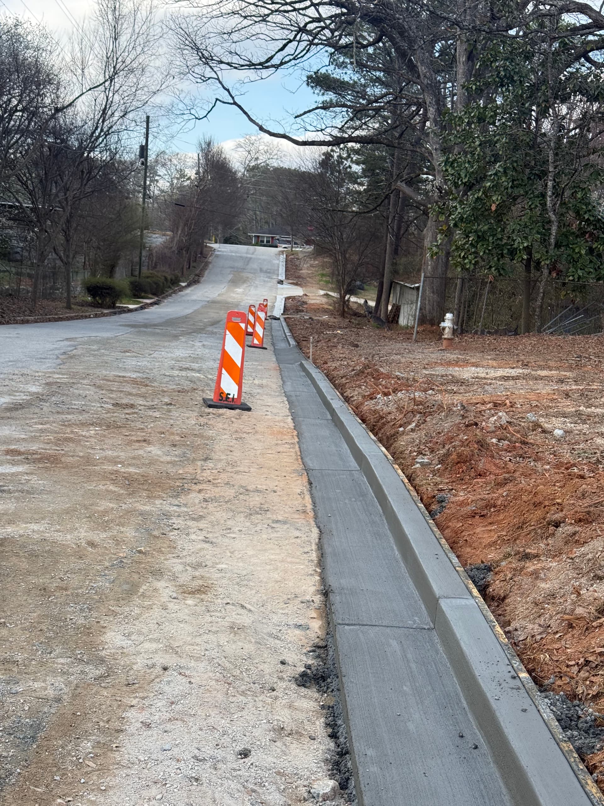 Gallery photos for New Concrete Curbs and Gutters Enhance Road Safety: Image #1