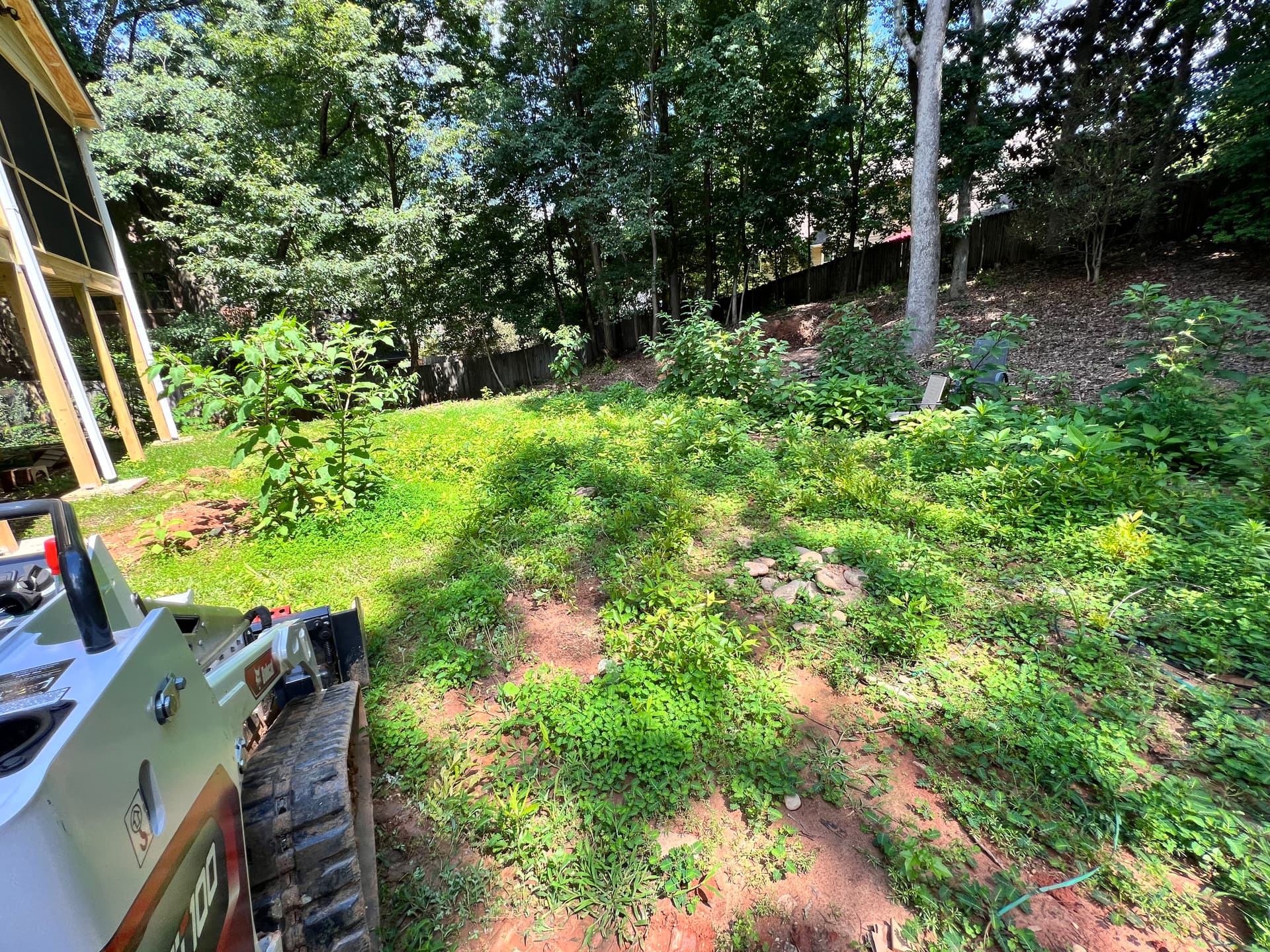 Backyard Upgrade with Fresh Sod and River Rock image